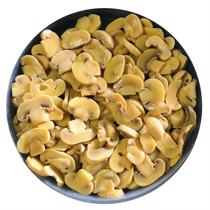 Sliced white mushroom in salty water in drums